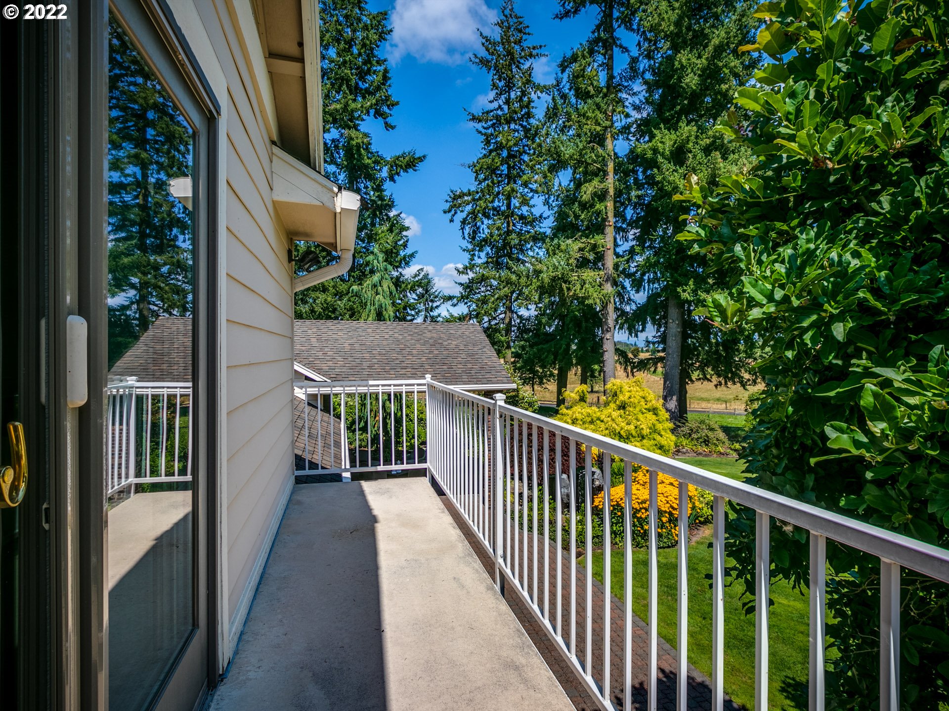 3515 Northwest 221st Street Ridgefield, WA 98642 - Photo 19 of 32 a view of a balcony with wooden floor