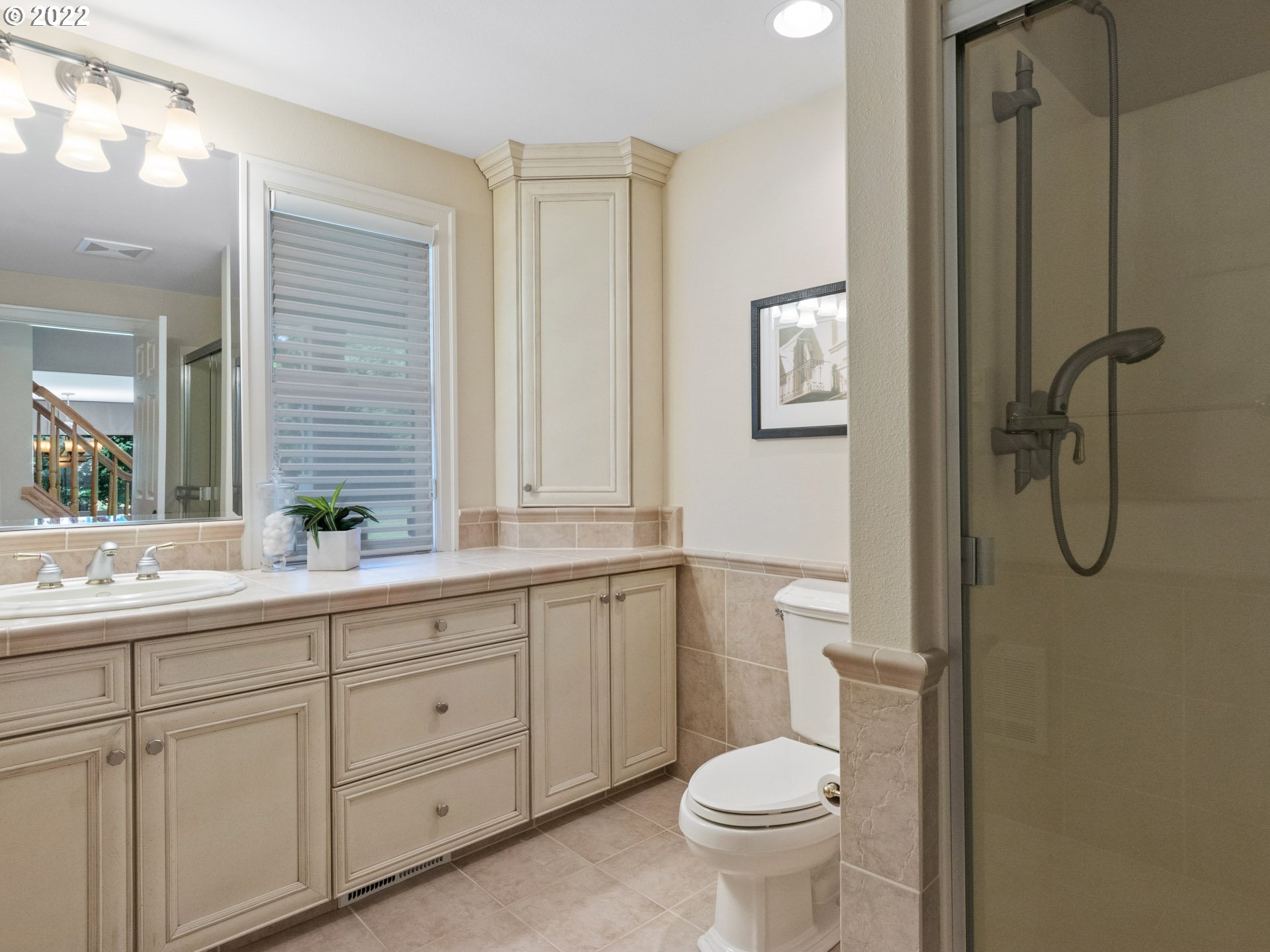 3515 Northwest 221st Street Ridgefield, WA 98642 - Photo 20 of 32 a bathroom with a granite countertop toilet sink and a mirror