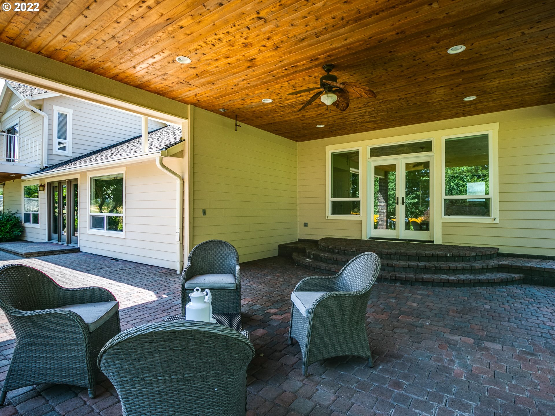 3515 Northwest 221st Street Ridgefield, WA 98642 - Photo 23 of 32 a front view of a house with a yard glass top table and chairs