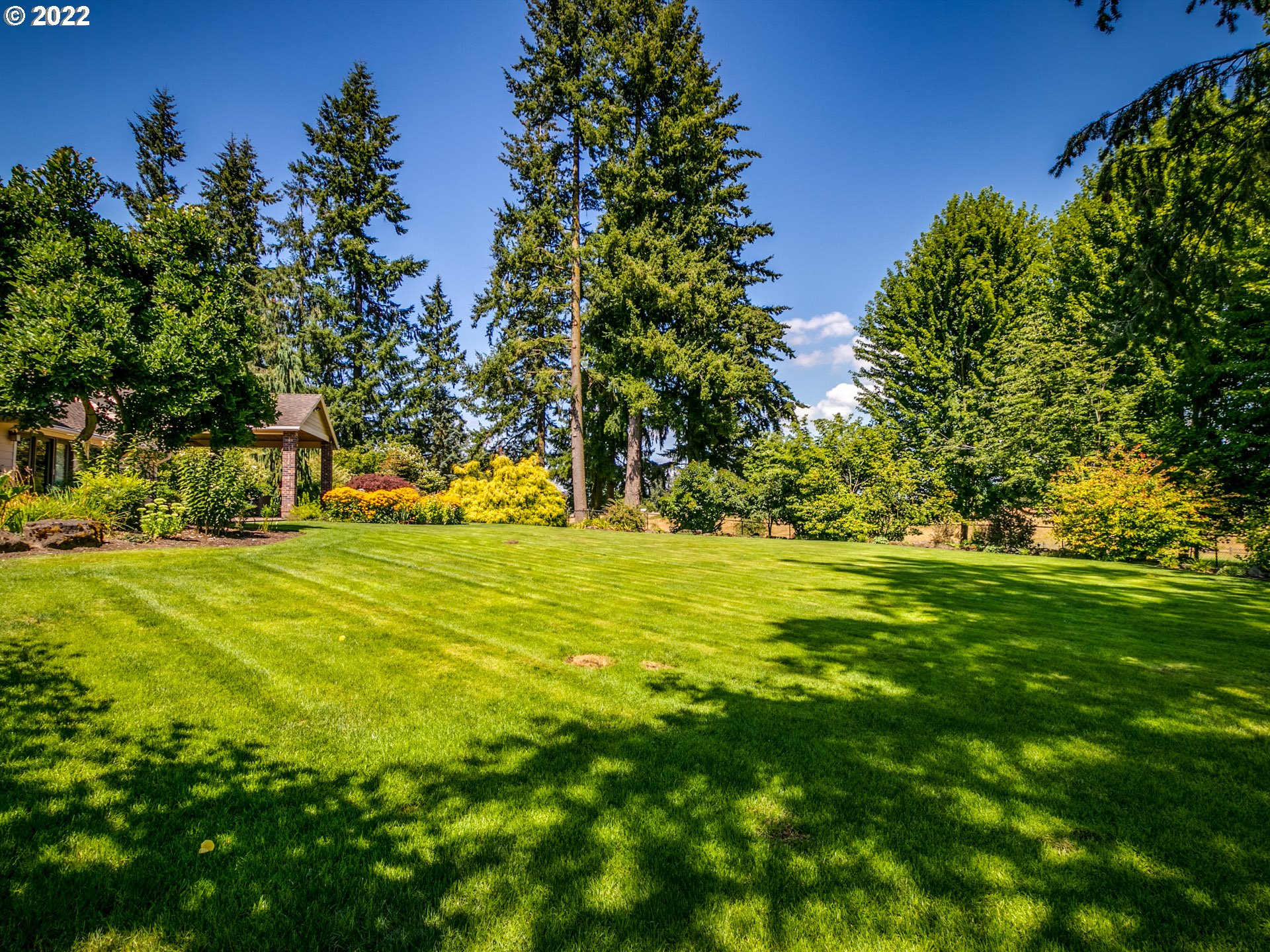 3515 Northwest 221st Street Ridgefield, WA 98642 - Photo 25 of 32 a view of yard with swimming pool and green space