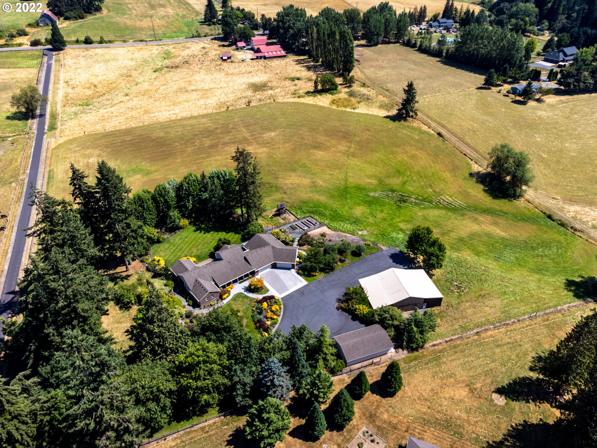 3515 Northwest 221st Street Ridgefield, WA 98642 - Photo 30 of 32 an aerial view of a house with swimming pool and ocean view
