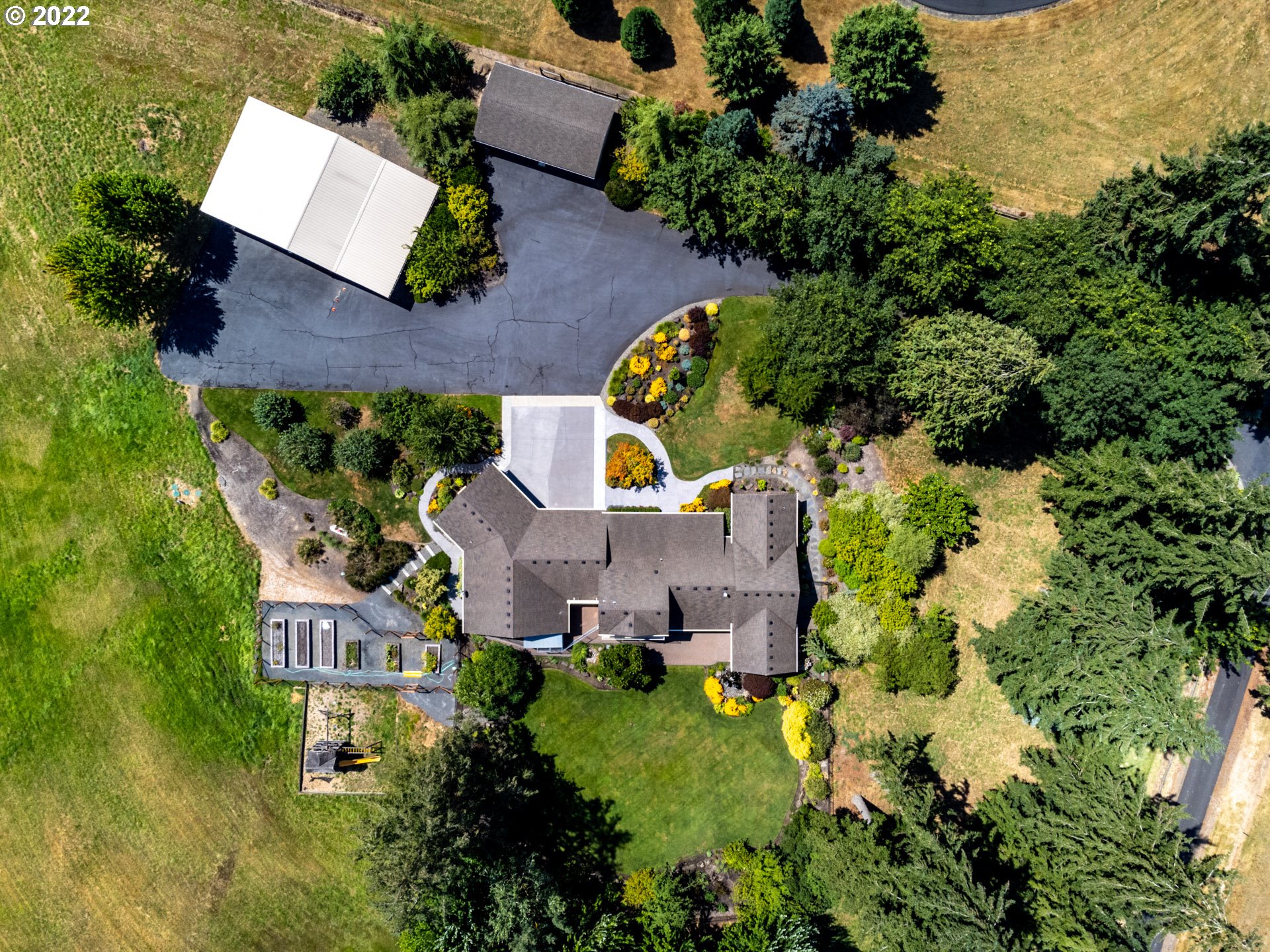 3515 Northwest 221st Street Ridgefield, WA 98642 - Photo 31 of 32 an aerial view of a house with a yard