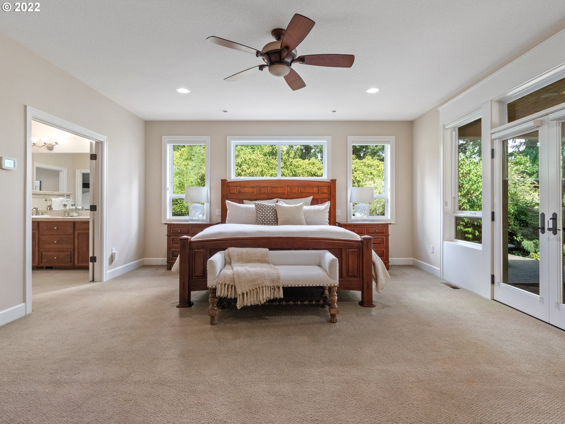 3515 Northwest 221st Street Ridgefield, WA 98642 - Photo 4 of 32 a bed room with a bed and a chandelier