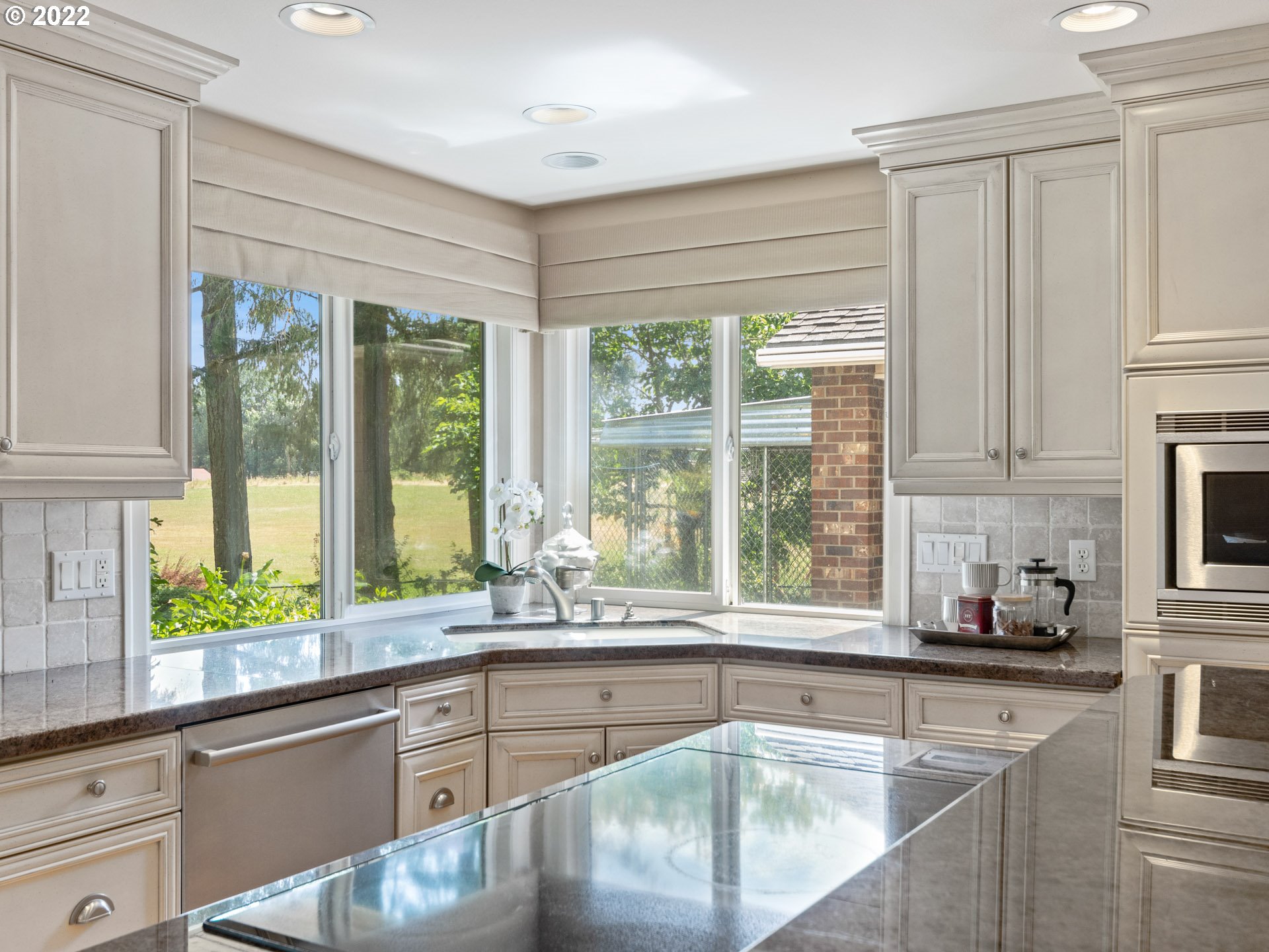 3515 Northwest 221st Street Ridgefield, WA 98642 - Photo 8 of 32 a kitchen with granite countertop a sink and a window