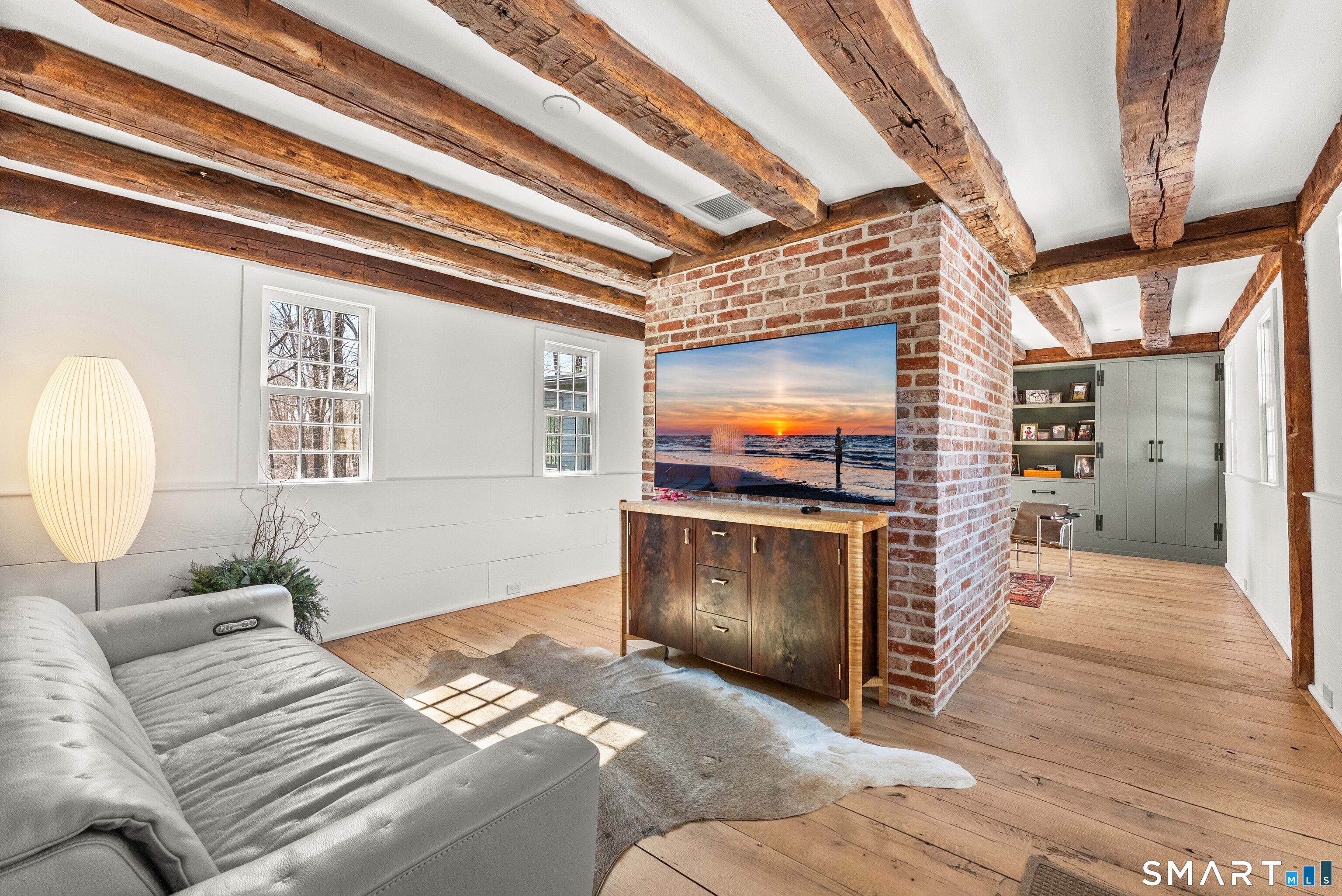 382 Weekeepeemee Road Woodbury, CT 06798 - Photo 11 of 40 a living room with furniture and a flat screen tv