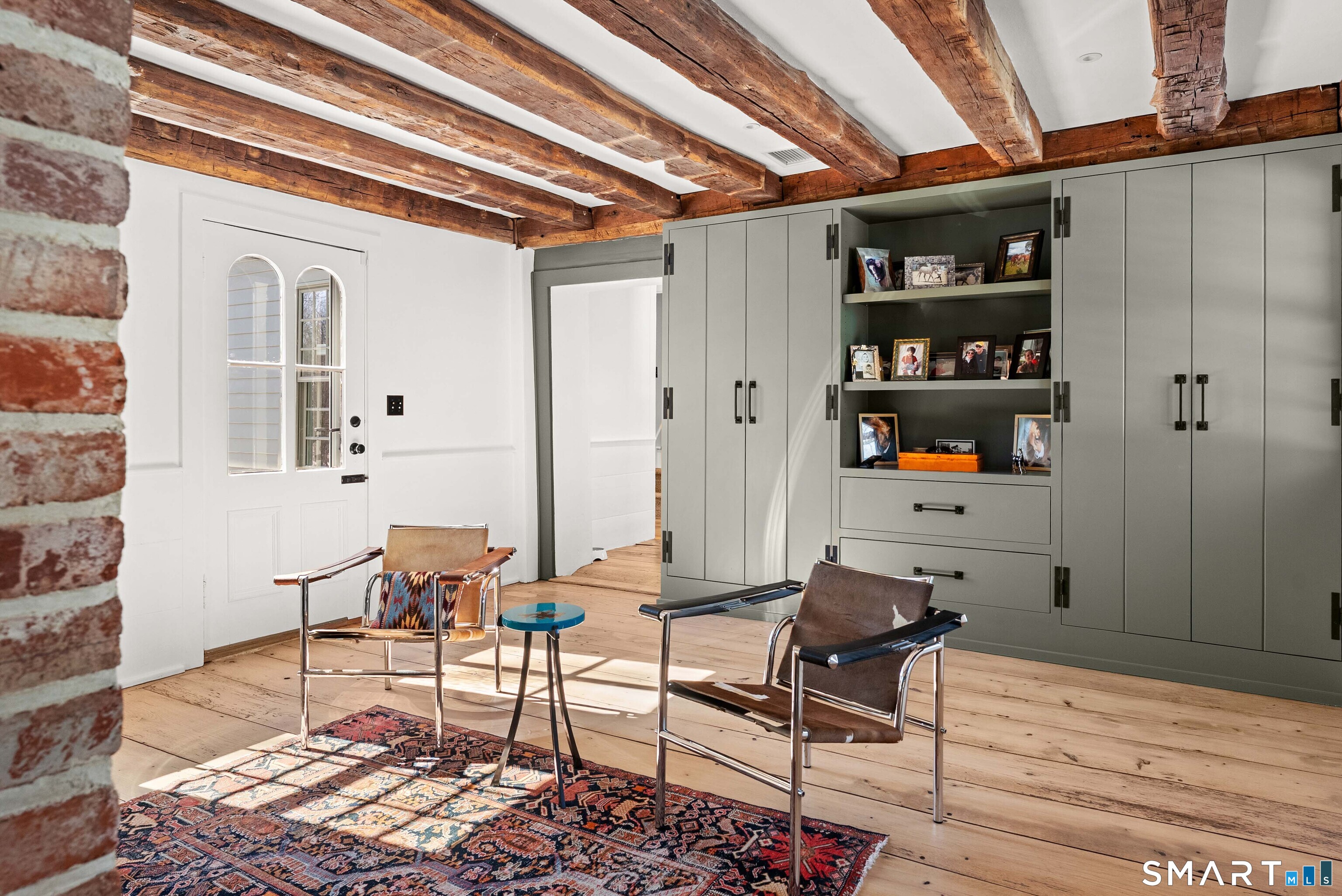 382 Weekeepeemee Road Woodbury, CT 06798 - Photo 12 of 40 a workspace with furniture and wooden floor