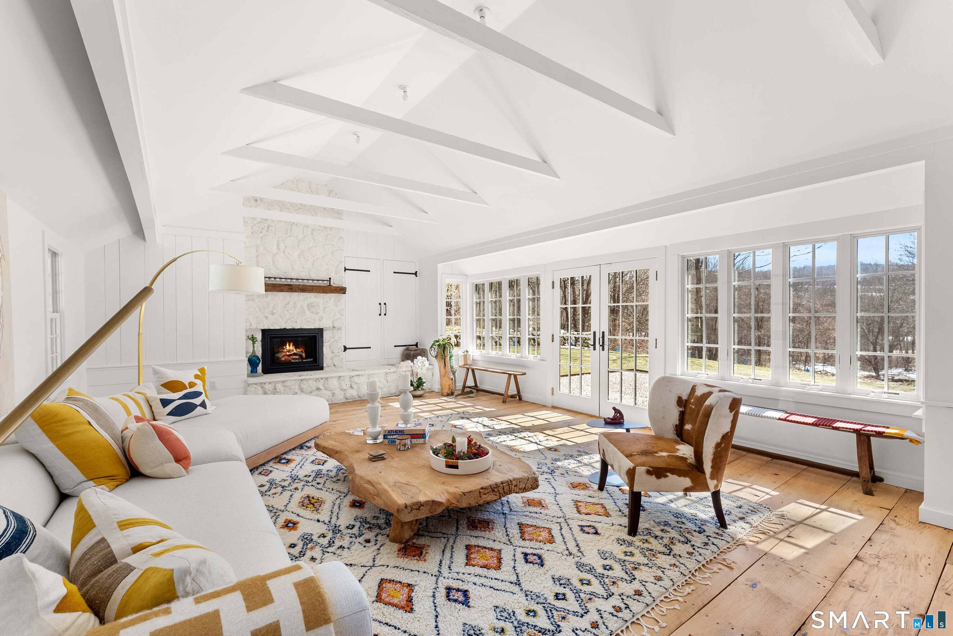 382 Weekeepeemee Road Woodbury, CT 06798 - Photo 15 of 40 a living room with furniture and a large window