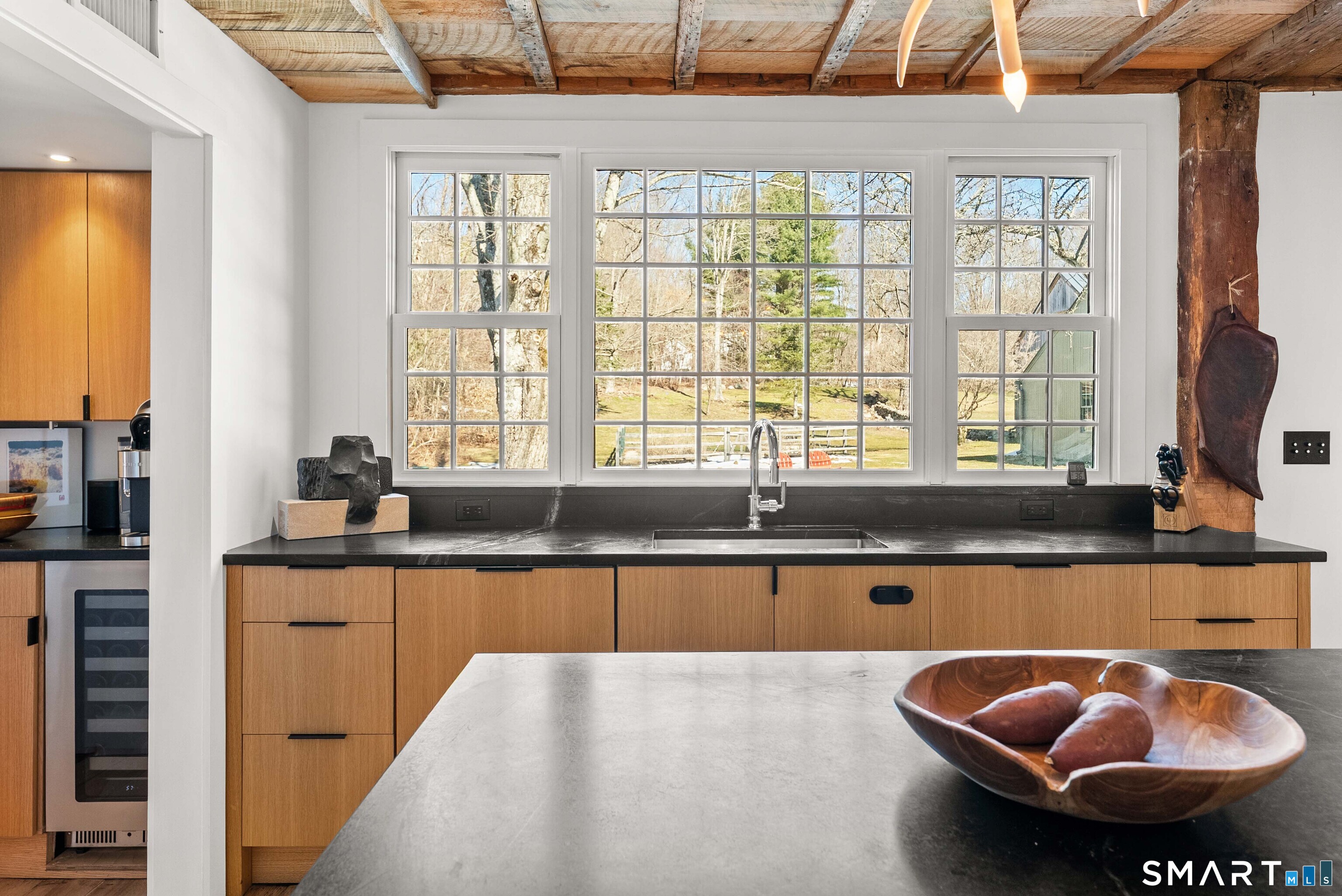 382 Weekeepeemee Road Woodbury, CT 06798 - Photo 18 of 40 a kitchen with a sink and a window