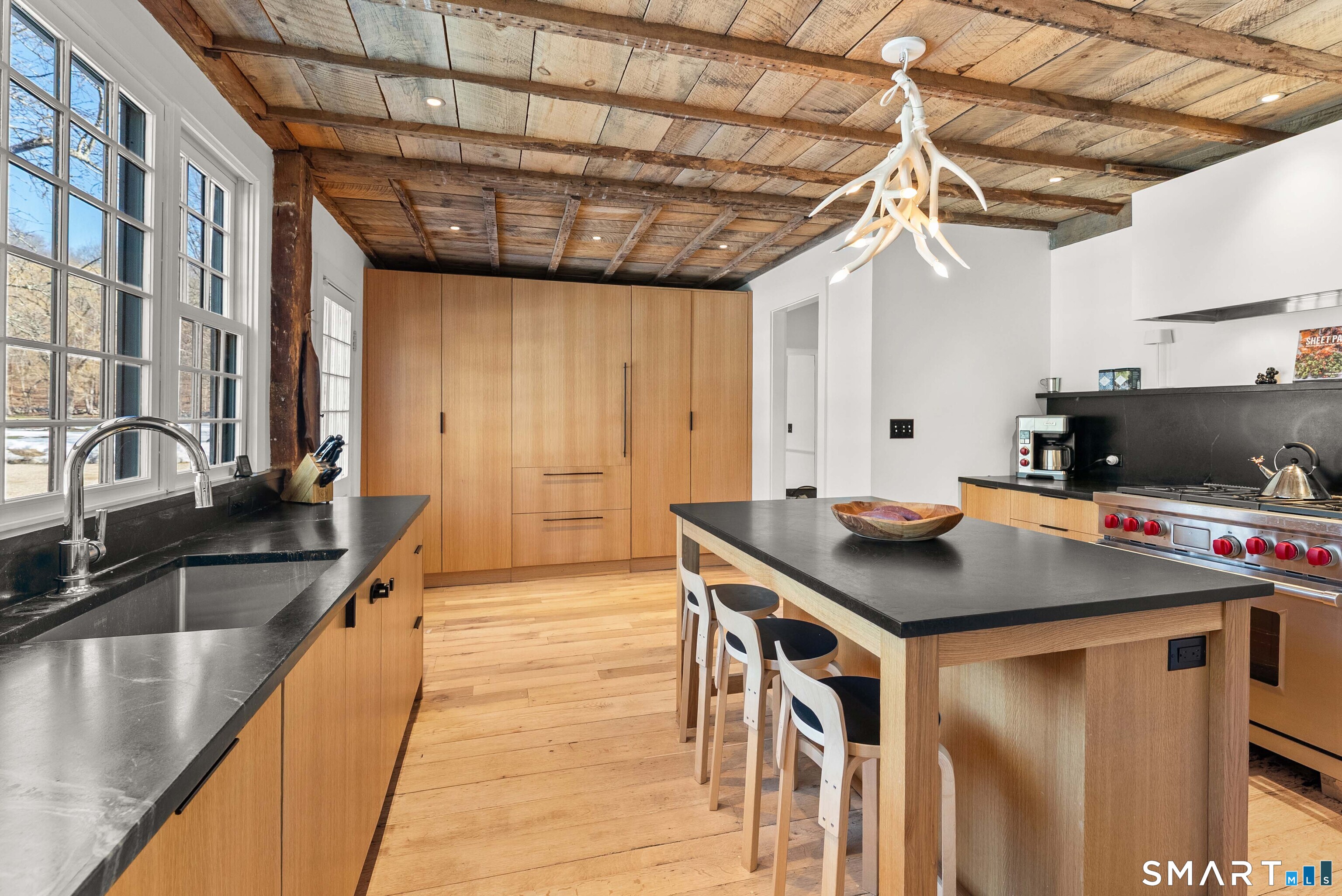 382 Weekeepeemee Road Woodbury, CT 06798 - Photo 19 of 40 a kitchen with a stove a sink and a refrigerator