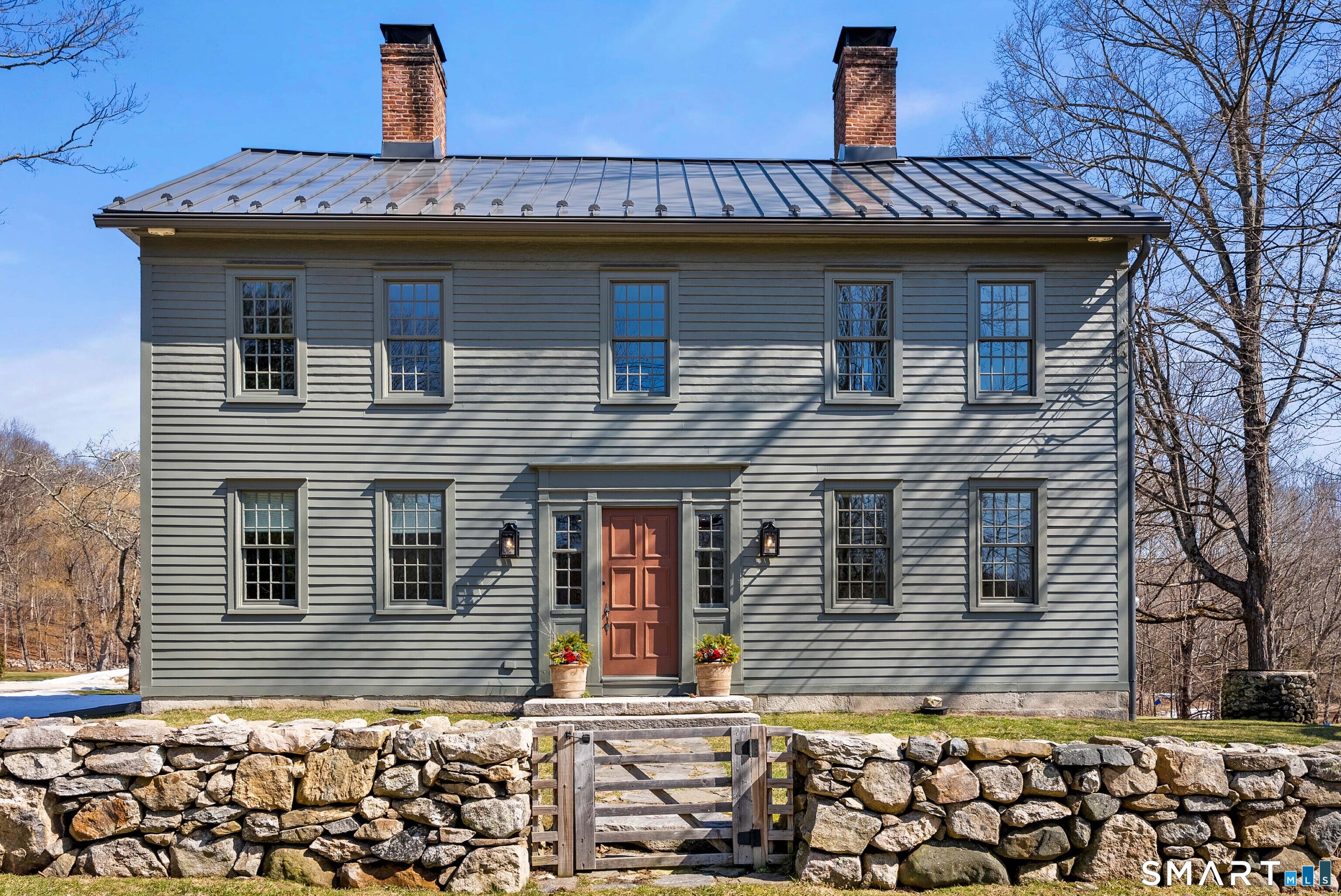 382 Weekeepeemee Road Woodbury, CT 06798 - Photo 2 of 40 a front view of a house with a wooden fence
