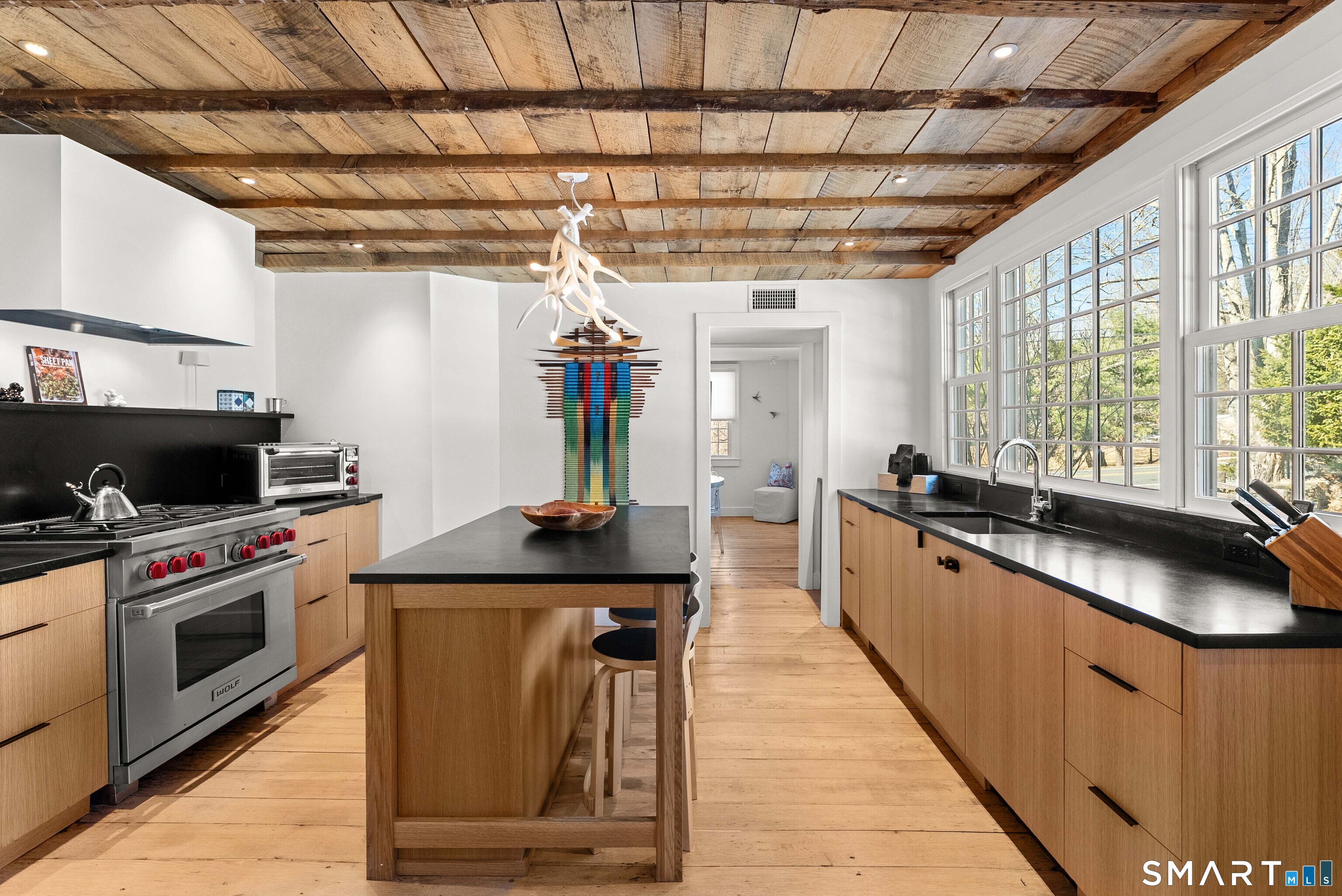 382 Weekeepeemee Road Woodbury, CT 06798 - Photo 21 of 40 a kitchen with granite countertop a sink a counter space appliances and cabinets