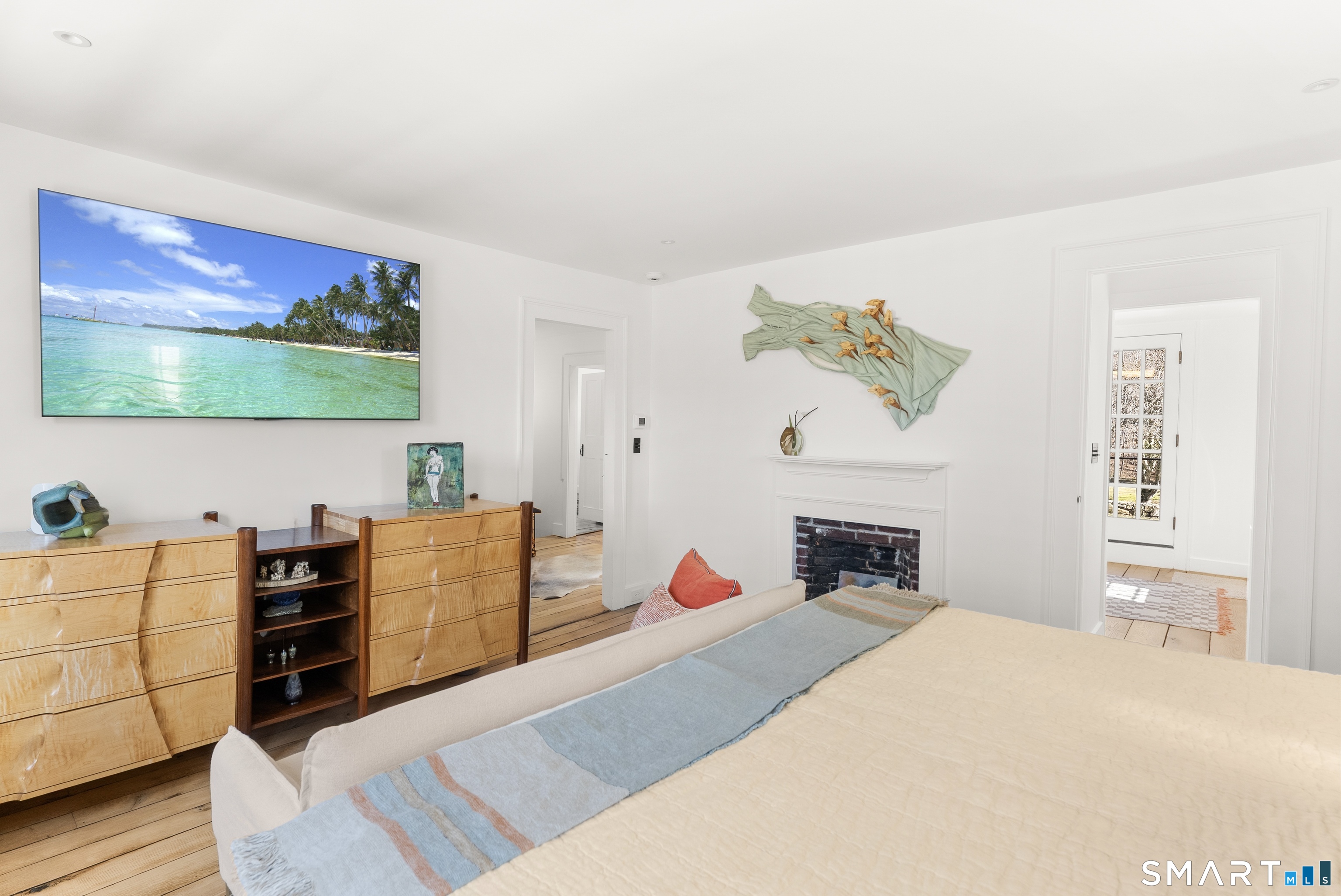 382 Weekeepeemee Road Woodbury, CT 06798 - Photo 25 of 40 a bedroom with furniture and a fireplace