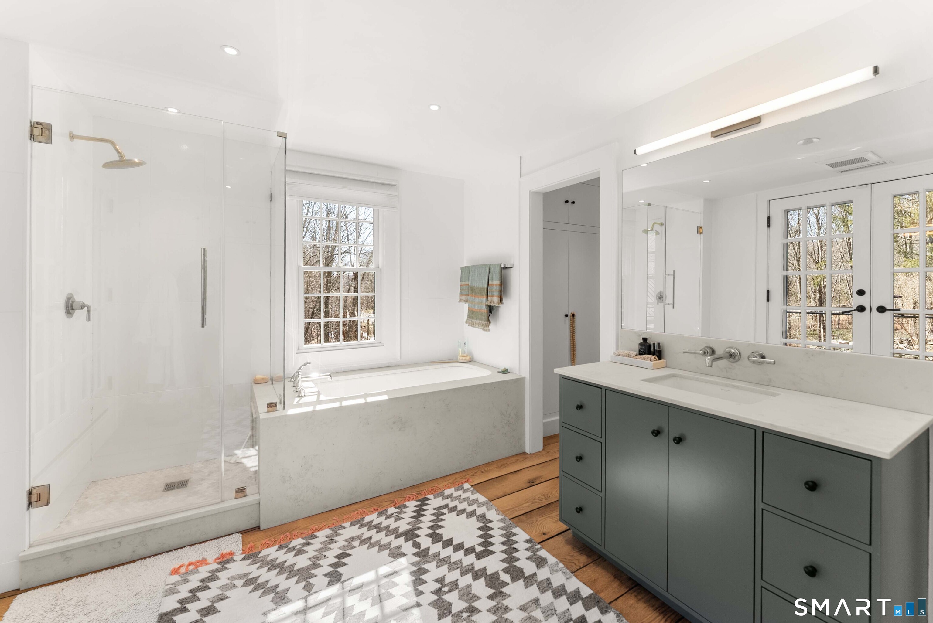 382 Weekeepeemee Road Woodbury, CT 06798 - Photo 26 of 40 a bathroom with a tub sink shower and two mirror