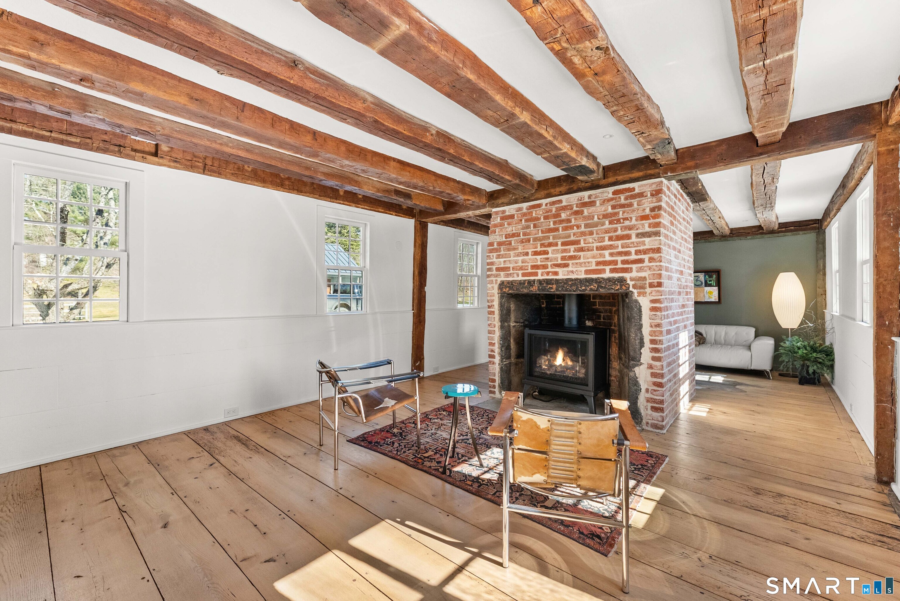 382 Weekeepeemee Road Woodbury, CT 06798 - Photo 10 of 40 a living room with furniture and a fireplace