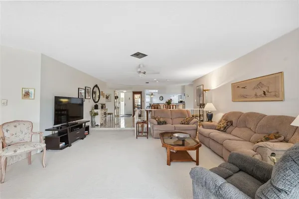 a kitchen with stainless steel appliances a stove a sink and white cabinets