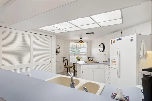 a spacious bedroom with a bed and a flat screen tv