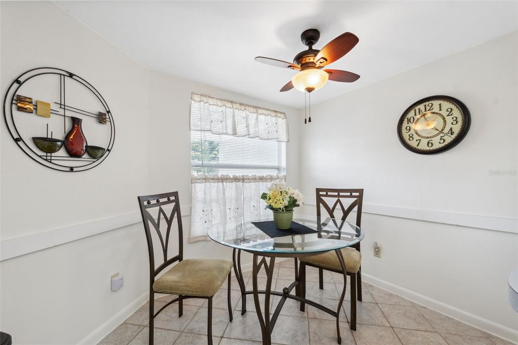 3942 Trophy Boulevard New Port Richey, FL 34655 - Photo 20 of 78 a view of a dining room with furniture and chandelier