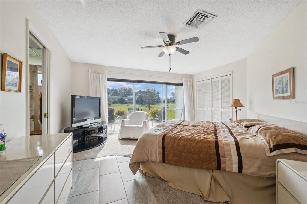 3942 Trophy Boulevard New Port Richey, FL 34655 - Photo 24 of 78 a bed room with a bed and a large window