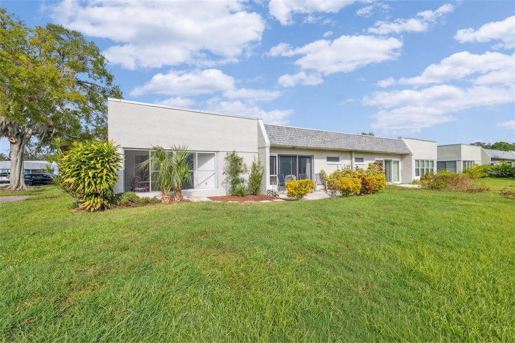 3942 Trophy Boulevard New Port Richey, FL 34655 - Photo 41 of 78 a view of a house with backyard and a tree