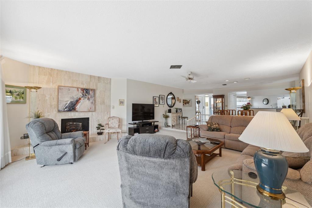 3942 Trophy Boulevard New Port Richey, FL 34655 - Photo 9 of 78 a living room with furniture and a flat screen tv