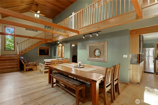 a view of a dining room with furniture and chandelier