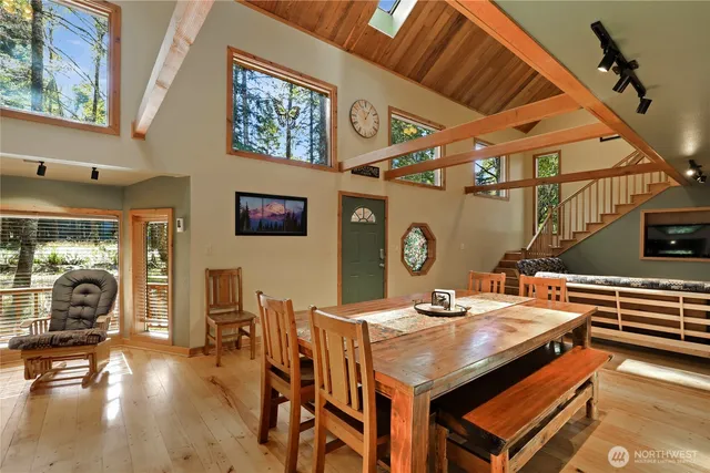 a dining hall with dining table and chairs