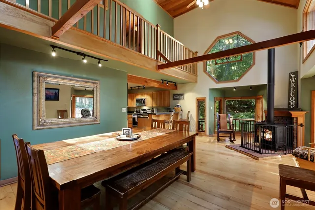 a living room with furniture stairs and a chandelier