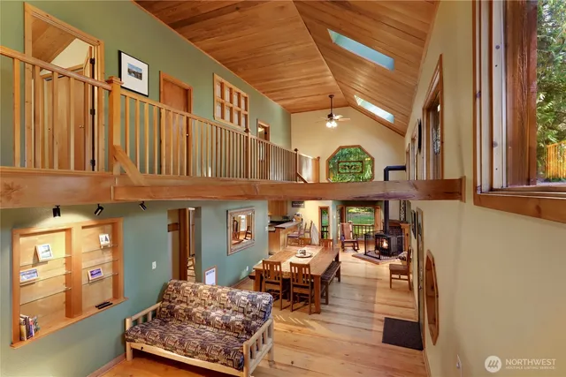 a bathroom with a sink a toilet a mirror and shower