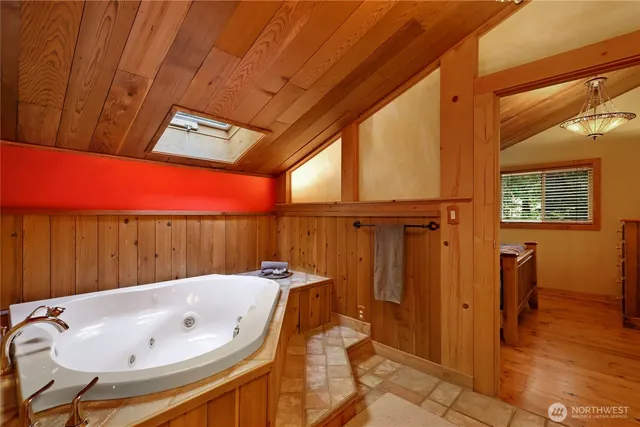 a view of balcony with wooden floor and seating