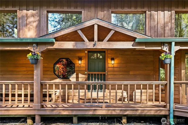 a view of two chairs in the balcony