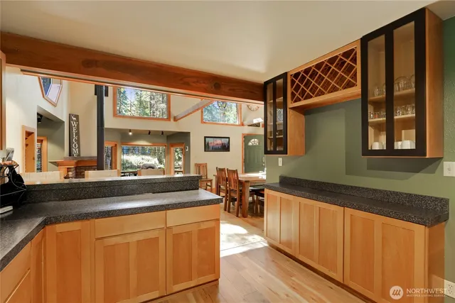 a kitchen with a sink and a large window