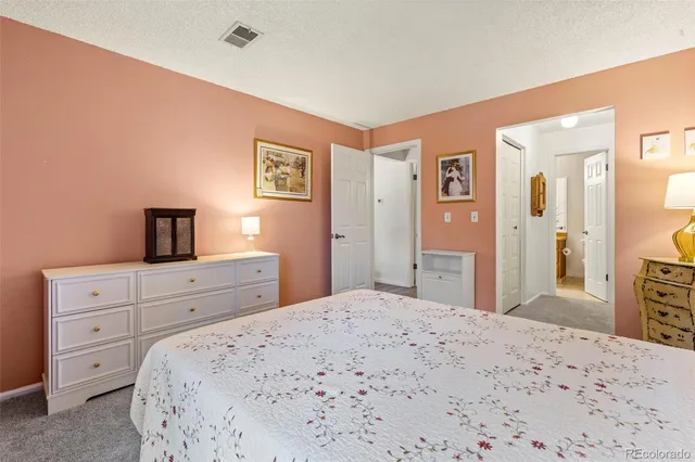a view of a hallway with wooden shelves
