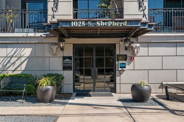 a view of a patio with table and chairs potted plants