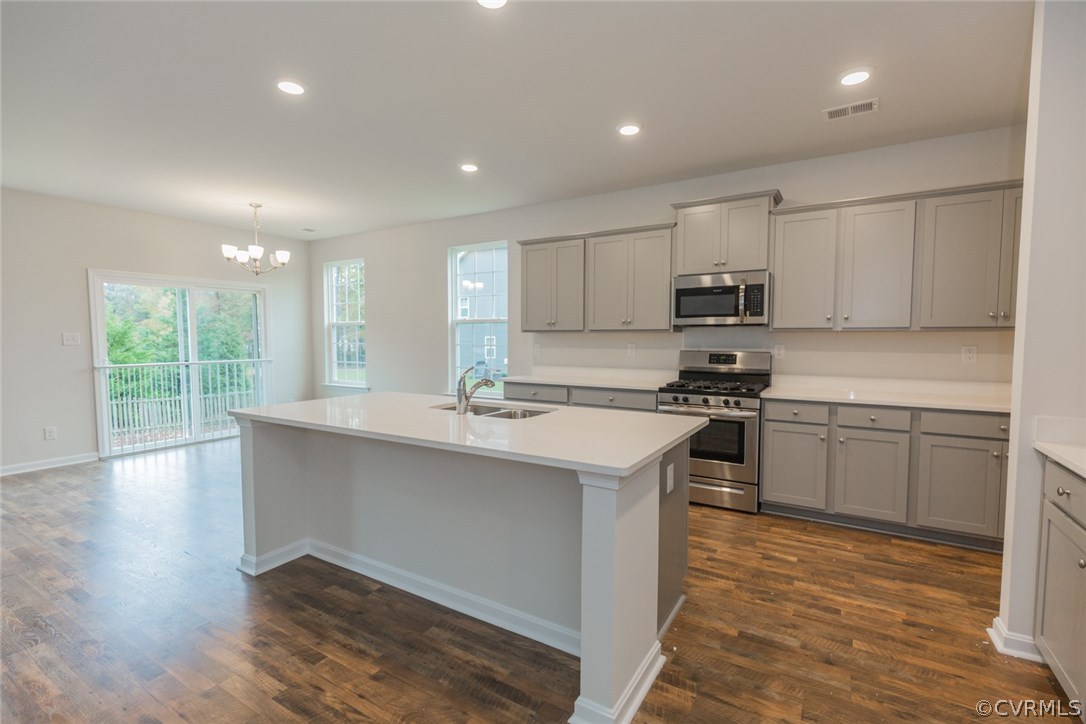 1312 Braisden Road Midlothian, VA 23114 - Photo 3 of 44 a kitchen with kitchen island a sink stainless steel appliances and cabinets