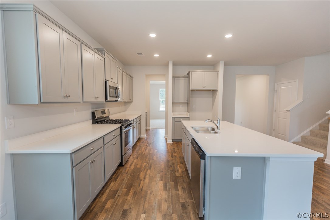 1312 Braisden Road Midlothian, VA 23114 - Photo 5 of 44 a large kitchen with a large counter top a sink stainless steel appliances and cabinets