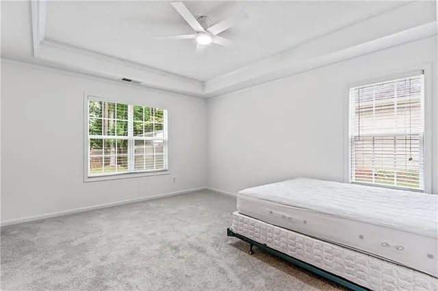 a room with a bed and a window