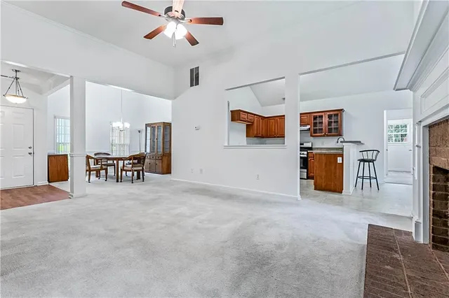 a view of a livingroom with a ceiling fan furniture and ceiling fan