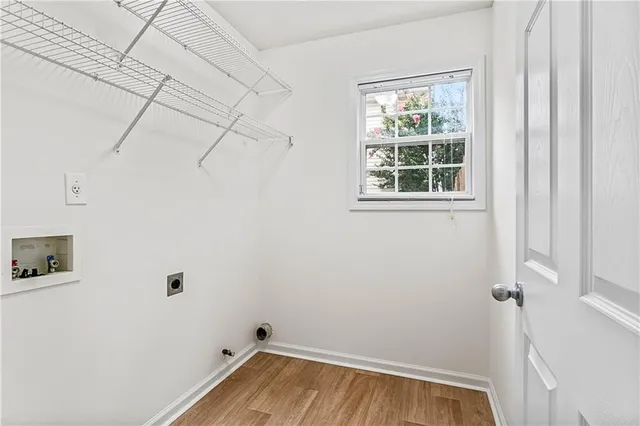 a view of a room with rack on the wall and a window