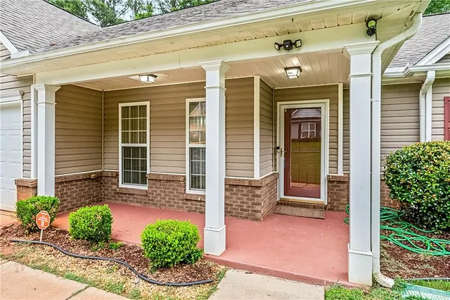 a front view of a house with garden