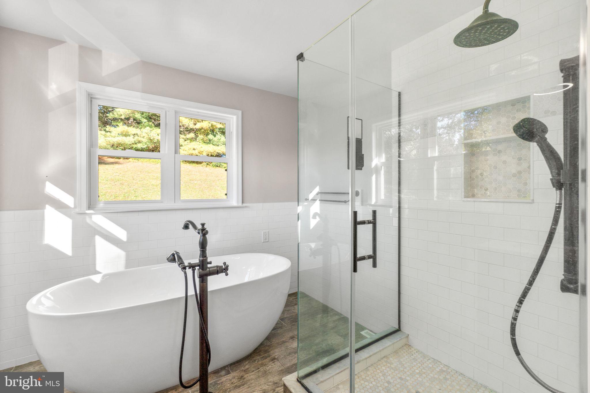 1414 Old New Windsor Road New Windsor, MD 21776 - Photo 8 of 10 a spacious bathroom with a bathtub and shower