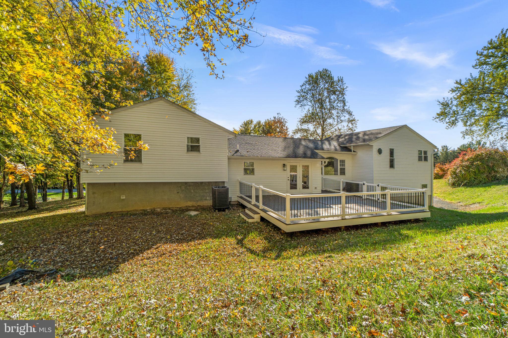 1414 Old New Windsor Road New Windsor, MD 21776 - Photo 10 of 10 a view of a house with a yard patio and fire pit