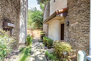5626 Preston Oaks Road, Unit 39C Dallas, TX 75254 - Photo 24 of 38 View of home's exterior featuring brick siding