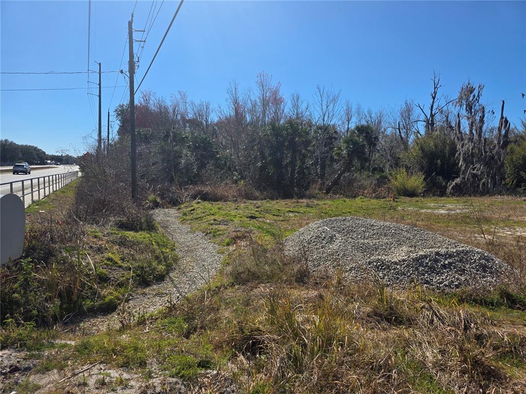 470 State Rte 415 Osteen, FL 32764 - Photo 8 of 8 a view of a backyard
