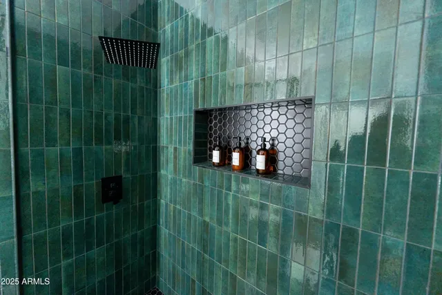 a spacious bathroom with a double vanity sink and a mirror