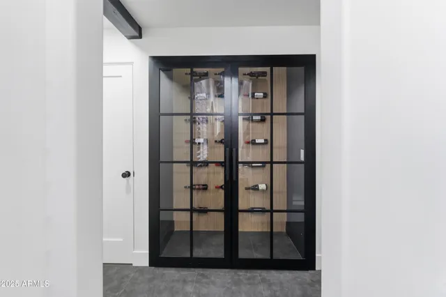a bathroom with double vanity sinks and a mirror