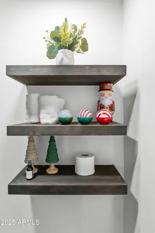 a bedroom with a bed and a large window with the outer view