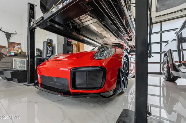 a view of backyard with swimming pool and seating space