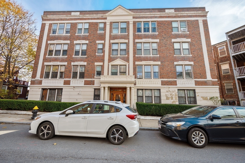 21 Sutherland Road, Unit 15 Boston, MA 02135 - Photo 13 of 13 a car parked in front of a building