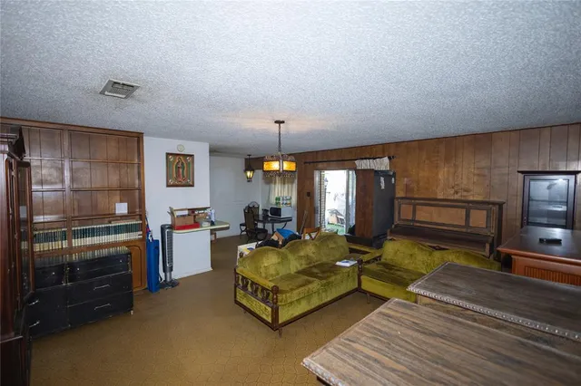 a kitchen with stove and refrigerator