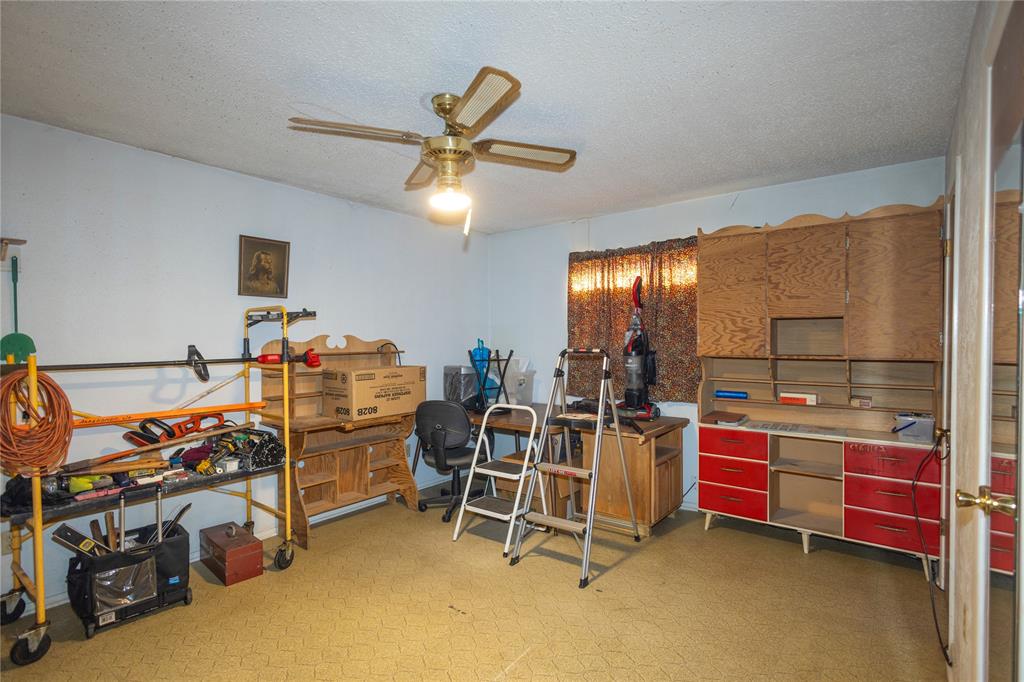 809 Lomo Street Fort Worth, TX 76110 - Photo 19 of 31 a view of a room with gym equipment